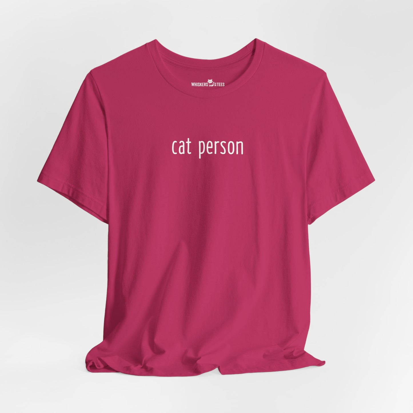 a pink t-shirt with words 'cat person' printed in white