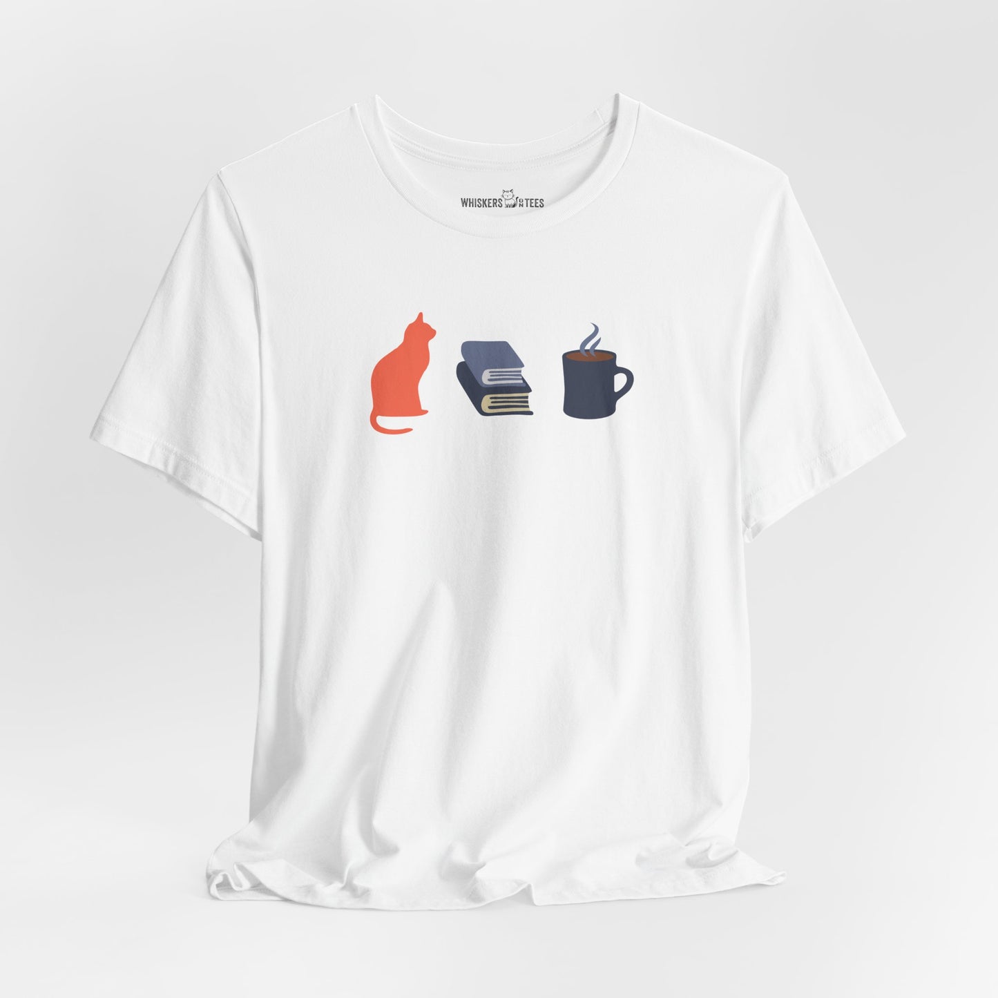 a white t-shirt with orange cat, blue books, dark blue steaming coffee mug