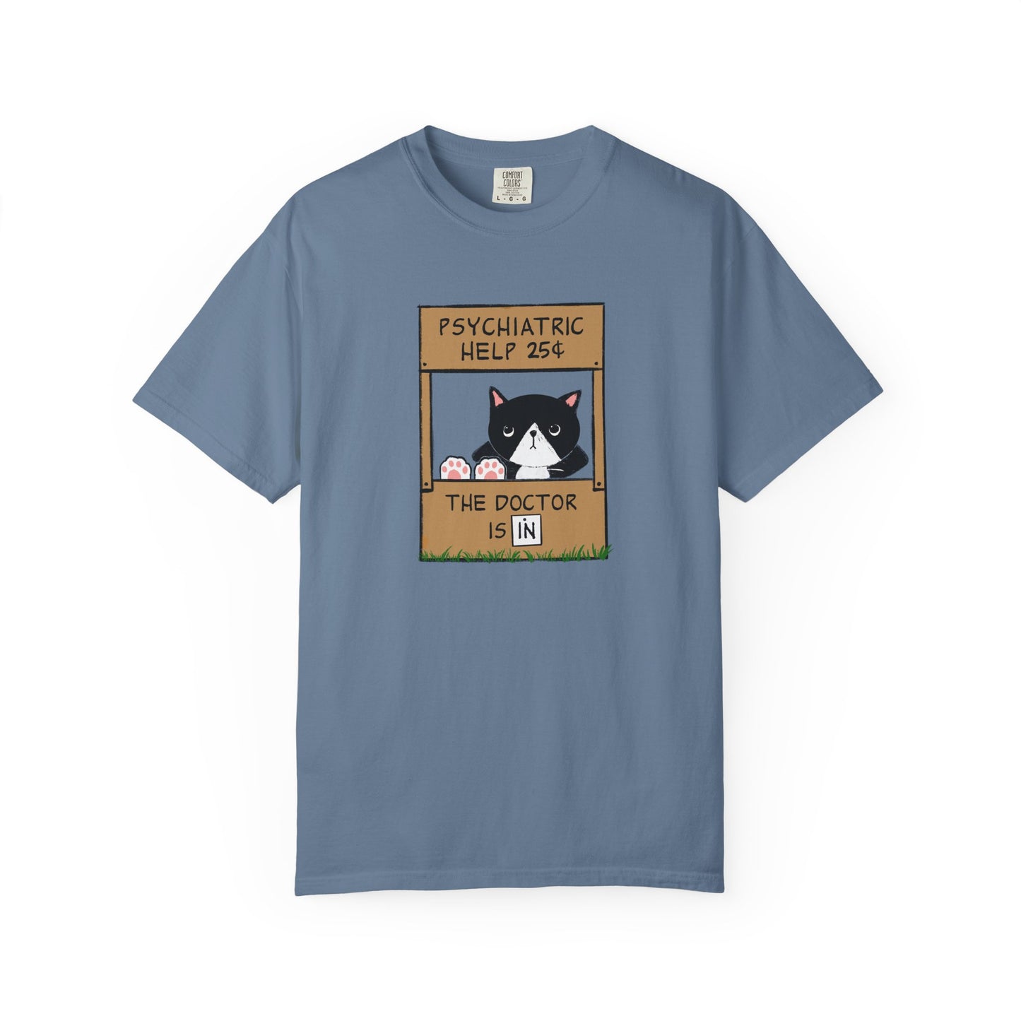 Blue t-shirt with a graphic of a cat with feet up on the counter of a booth showing signs reading "Psychiatric Help 25 cents" and "The Doctor is IN"