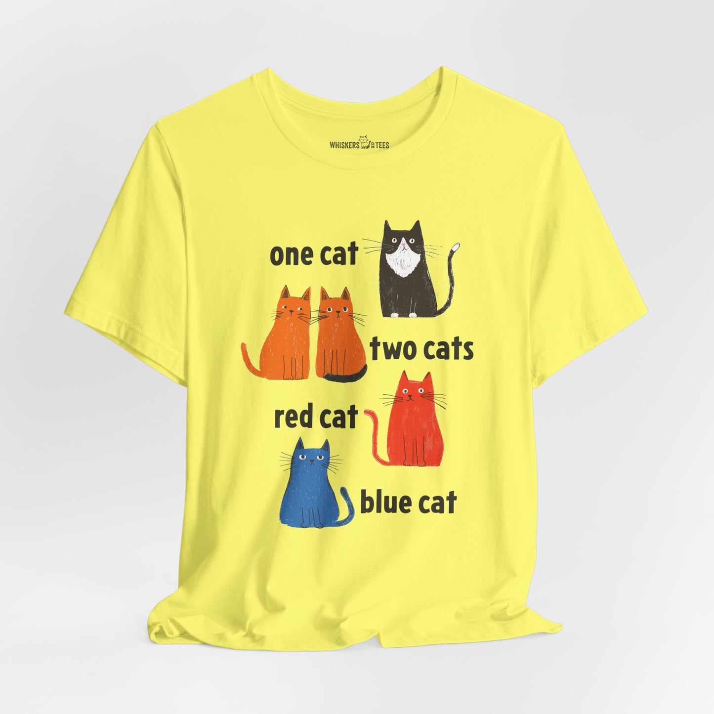 a bright yellow graphic t-shirt featuring one tuxedo cat, two orange cats, one red cat, and one blue cat