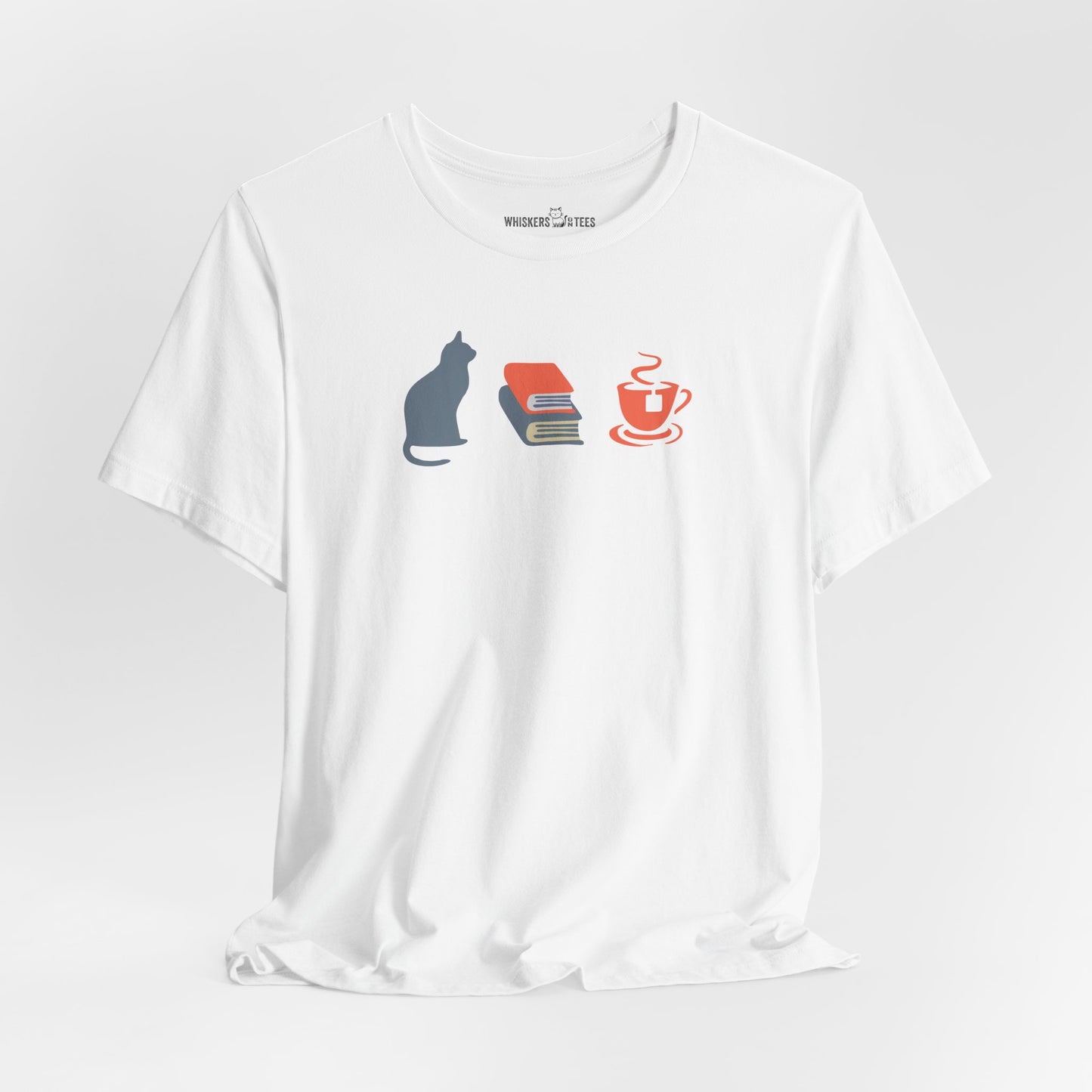 white graphic tee showing a powder-blue cat, orange and blue books, and orange tea cup