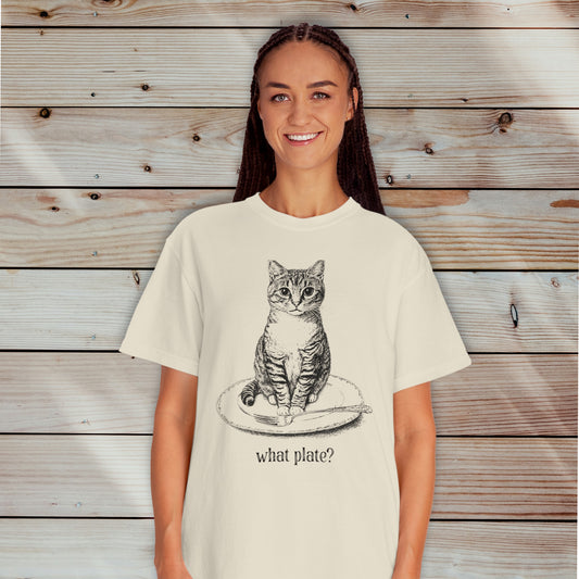 person wearing an ivory t-shirt with a detailed drawing of a cat on a dinner plate with fork, with text "What Plate?"
