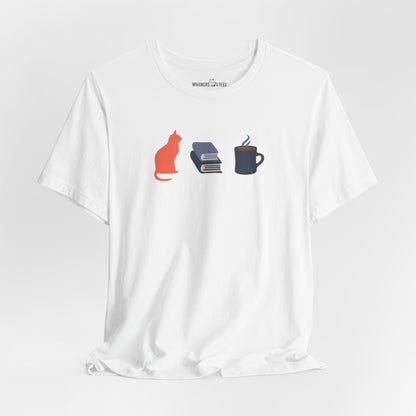 a white t-shirt with orange cat, blue books, dark blue steaming coffee mug