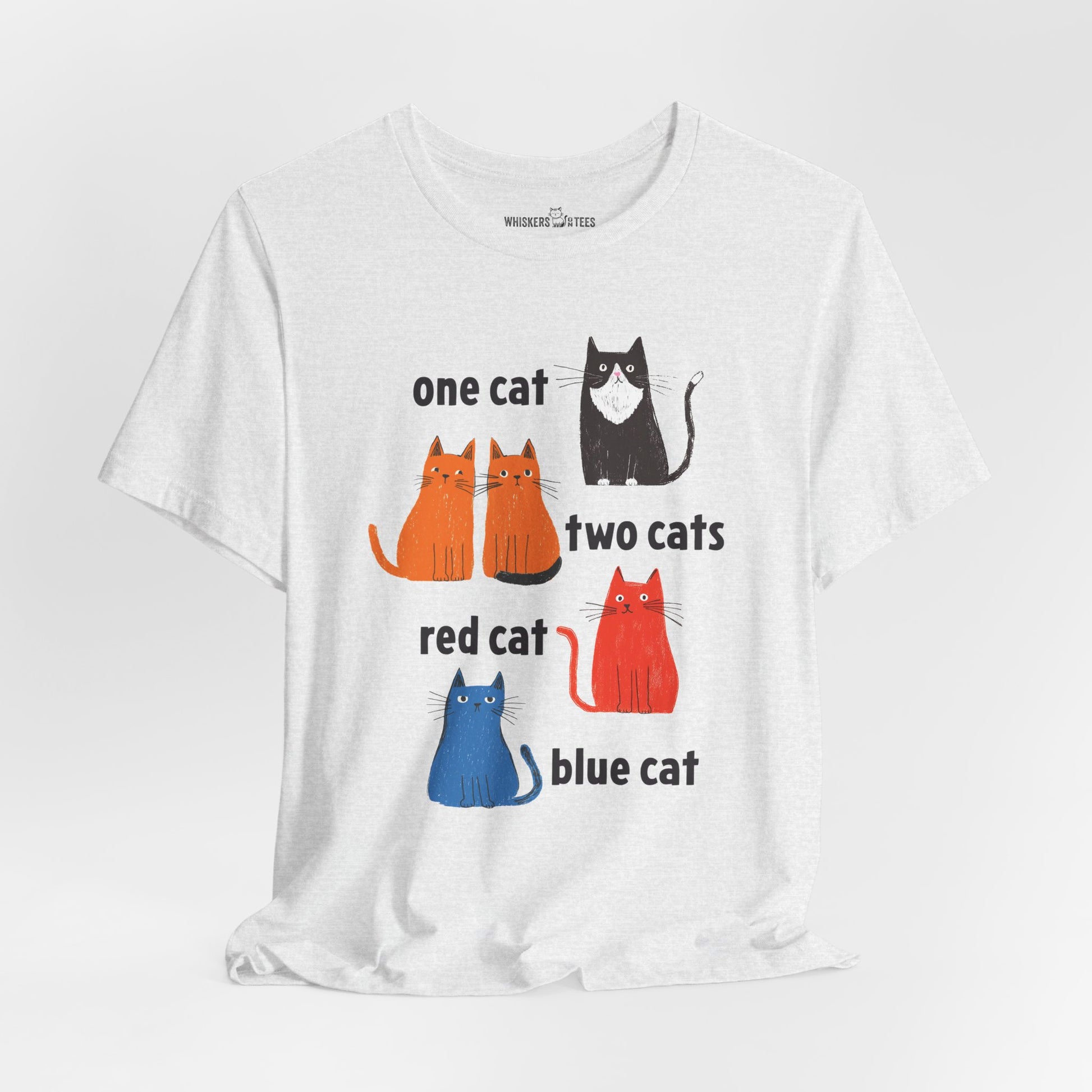a light gray heather graphic t-shirt featuring one tuxedo cat, two orange cats, one red cat, and one blue cat