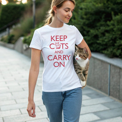 woman carrying a tabby cat wearing a white t-shirt with 'Keep Cats and Carry On' text on the front that incorporates the graphic of a nonchalant cat