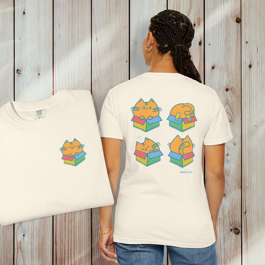 person wearing an ivory graphic t-shirt with chubby orange cat in a color box on the inset front view of the shirt, and four chubby orange cats each in its own colorful box on the back of the shirt
